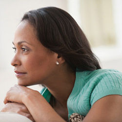 aging black woman gazing out window
